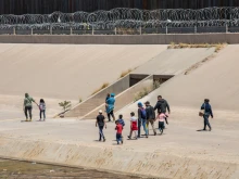 May 30, 2019: Migrants from Central America cross the U.S.-Mexico border at El Paso, Texas / Ciudad Juarez, Chihuahua, Mexico to seek asylum in the United States.